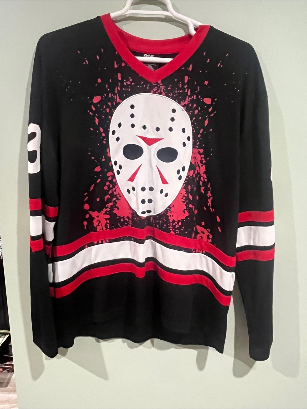 Black V-Neck Men's Graphic Hockey Mask Sweater with Red & White Accents